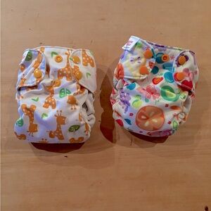 Two Blueberry Simplex newborn all in one diapers